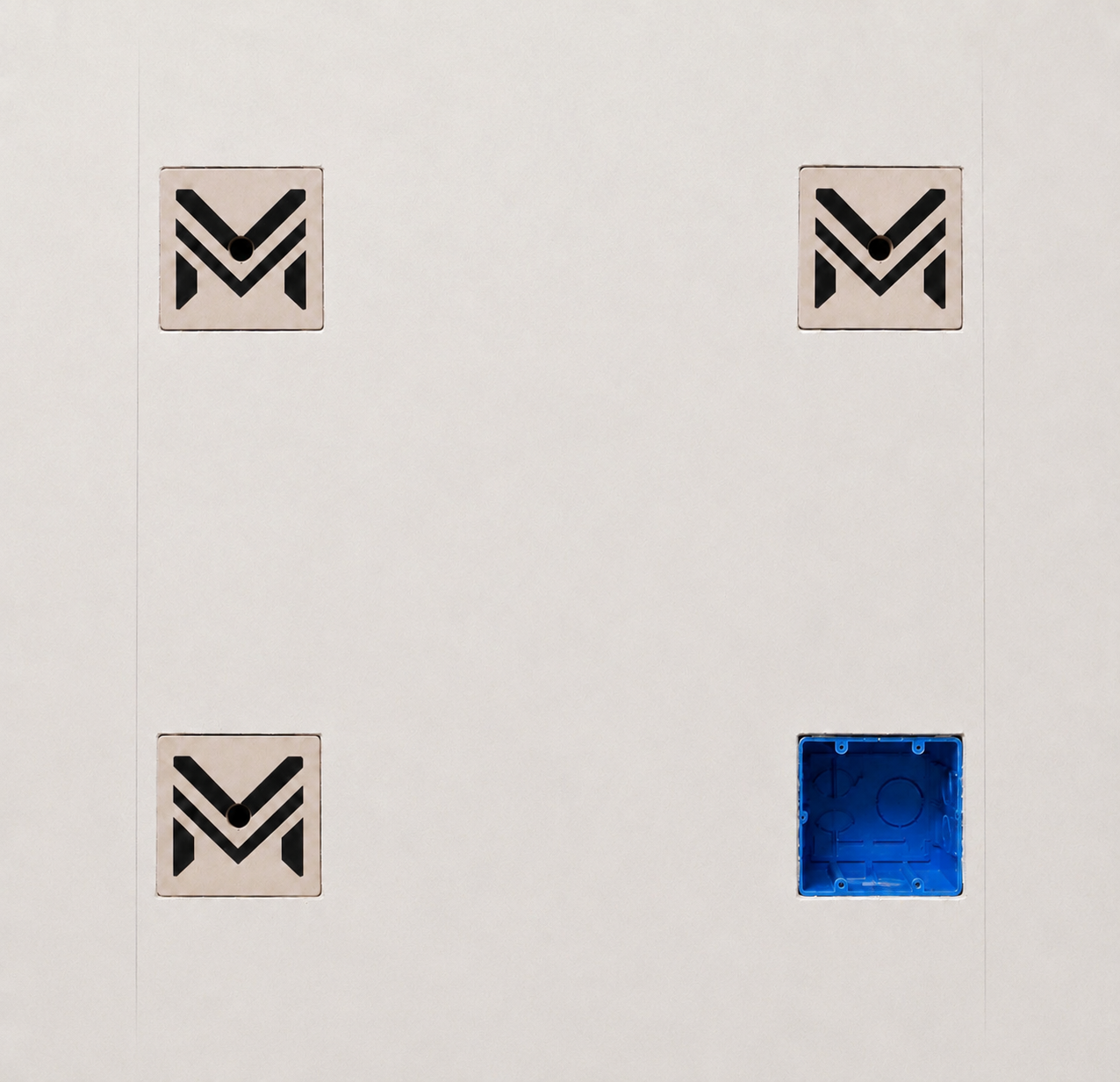 M-Plates installed over electrical boxes in drywall